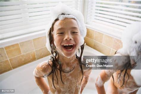 cute girls lesbian bathe together under a shower. one took the。